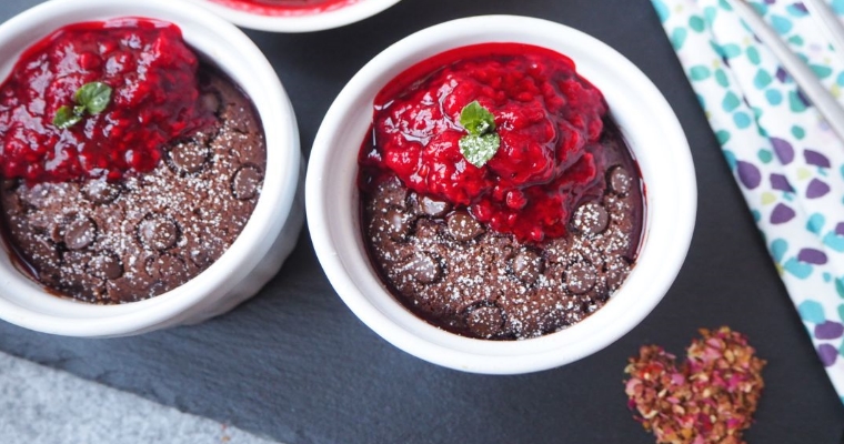 Vegan Recipe for a chocolatey mug cake with a fruity sweet raspberry sauce